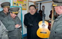 Создать мем Tsakhiagiin Elbegdorj with a guitar in military unit